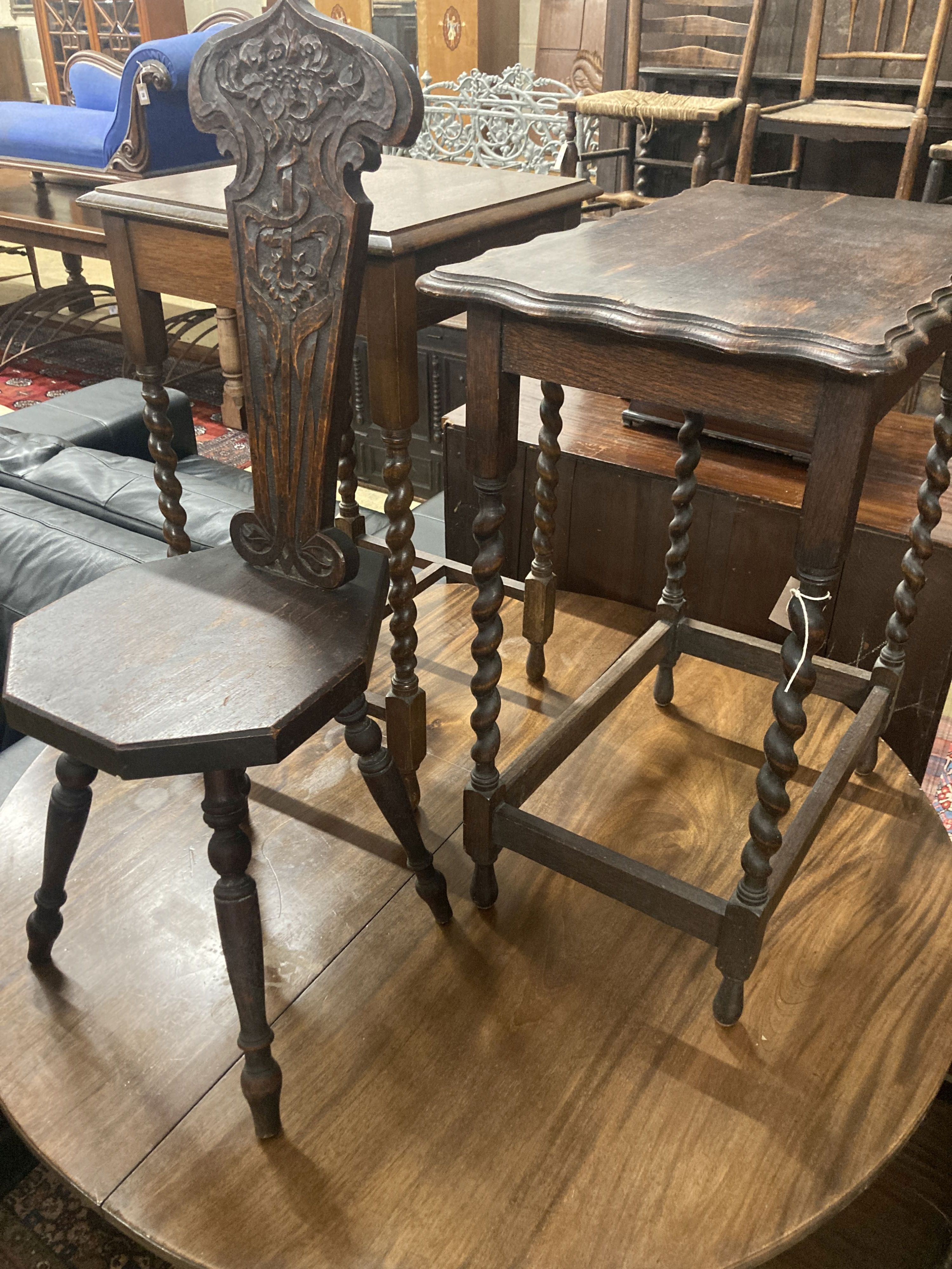 Two 1920s oak occasional tables, larger width 60cm, depth 37cm, height 72cm, together with a carved oak spinning chair